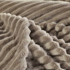 Zachte bruine pluchen deken, close-up textuur.