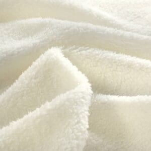 Zachte witte fleece stof textuurdetail.