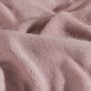 Roze fleece stof close-up textuur detail