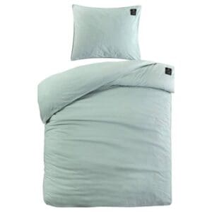 Lichtblauwe dekbedovertrekset met kussenhoes op bed